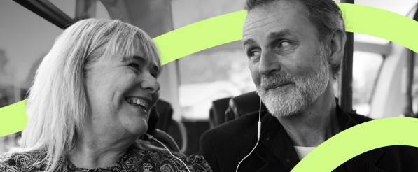 woman and man sharing earphones listening to music on bus