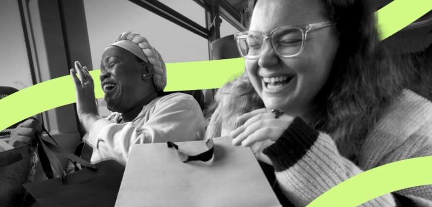 Two people sitting on a bus with shopping bags, green curved lines overlaid